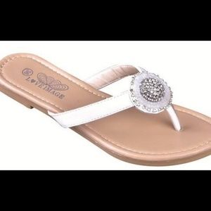 Beaded detail flip flop sandals in white.
